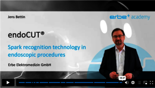 A man is explaining the endoCUT, the spark recognition technology in endoscopic procedures in a video course. 